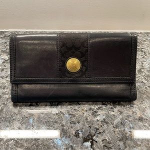 Black leather trifold coach wallet